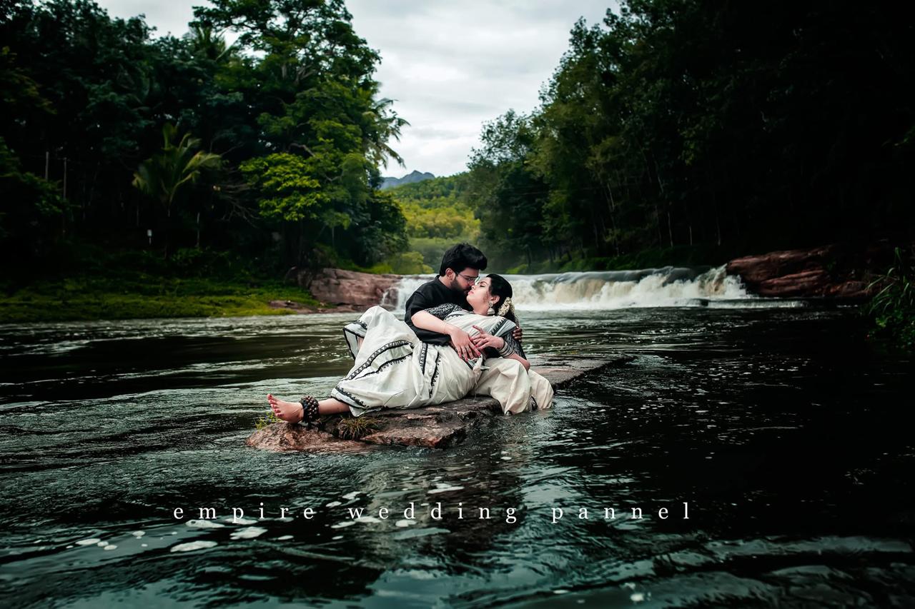 Wedding couple by a waterfall in Kerala